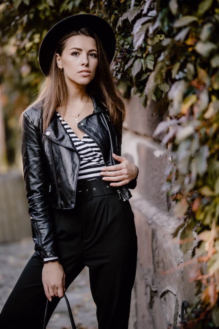 A stylish woman in a black vegan leather jacket, promoting eco-friendly fashion for a sustainable and ethical wardrobe.